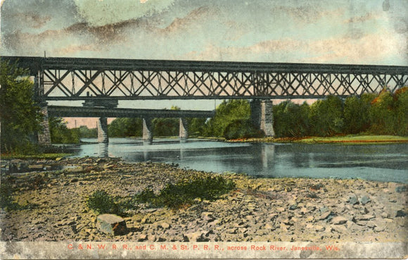 C. and N. W. R. R., and C. M. and St. Paul R. R., across Rock River, Janesville, WI-Carey's Emporium