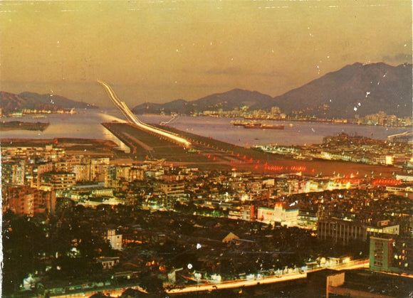 View of Plane Making a Night Landing at Kaitak-Carey's Emporium