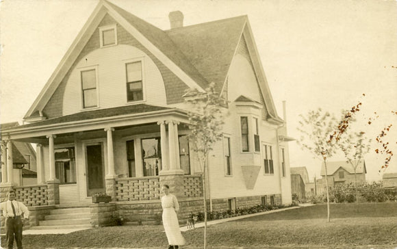 Couple in front of their House [Postcard]